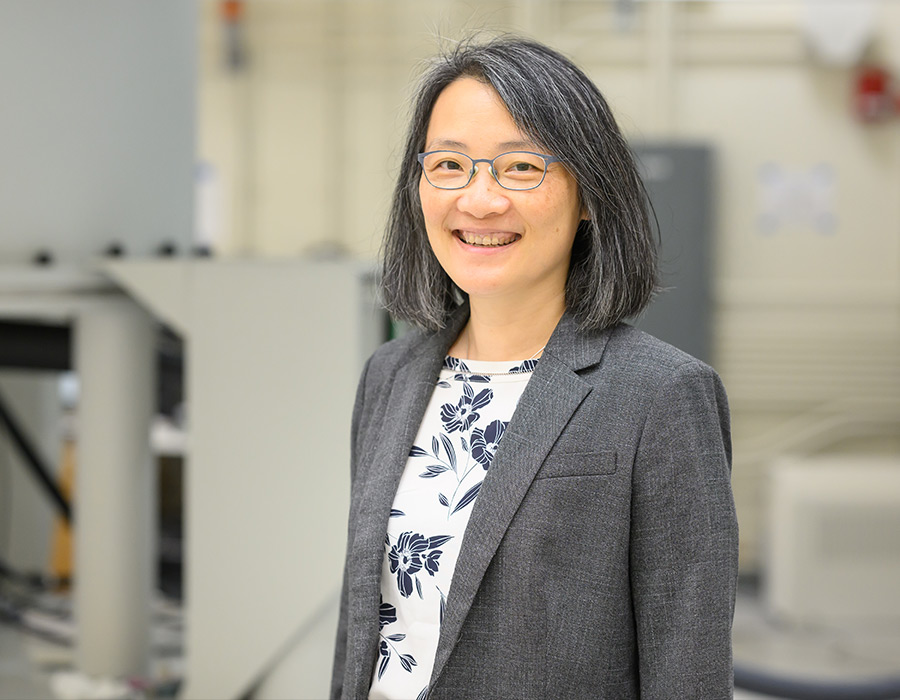 Professor Mei Hong smiles in her lab.