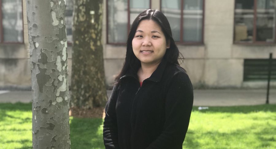 Jennifer Wong smiles outside on MIT Campus.