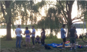 Image of students on the Esplanade at sunset.