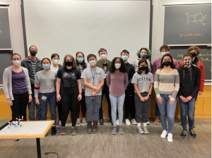 A group of masked students in the Undergraduate Teaching Lab.