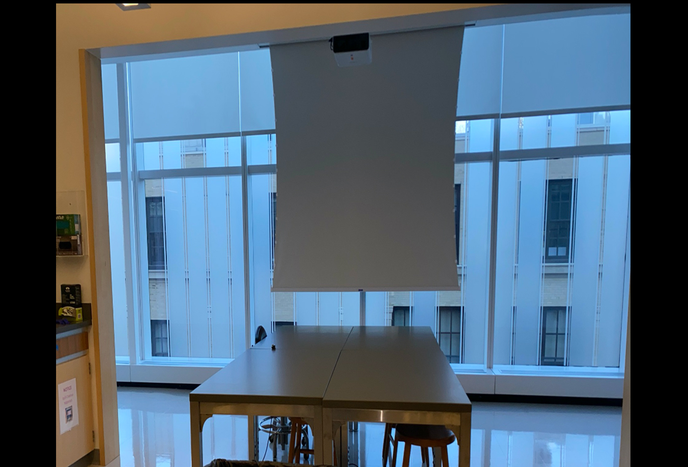 A screen dropped down in front of a window.