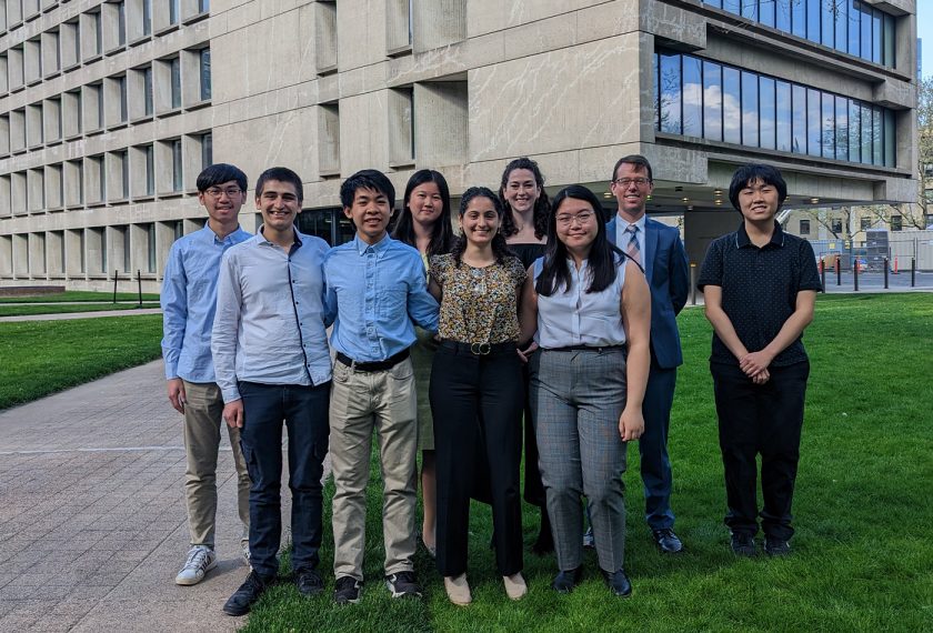 A photo of the UROP presenters standing in front of the Dreyfus Building on MIT Campus.