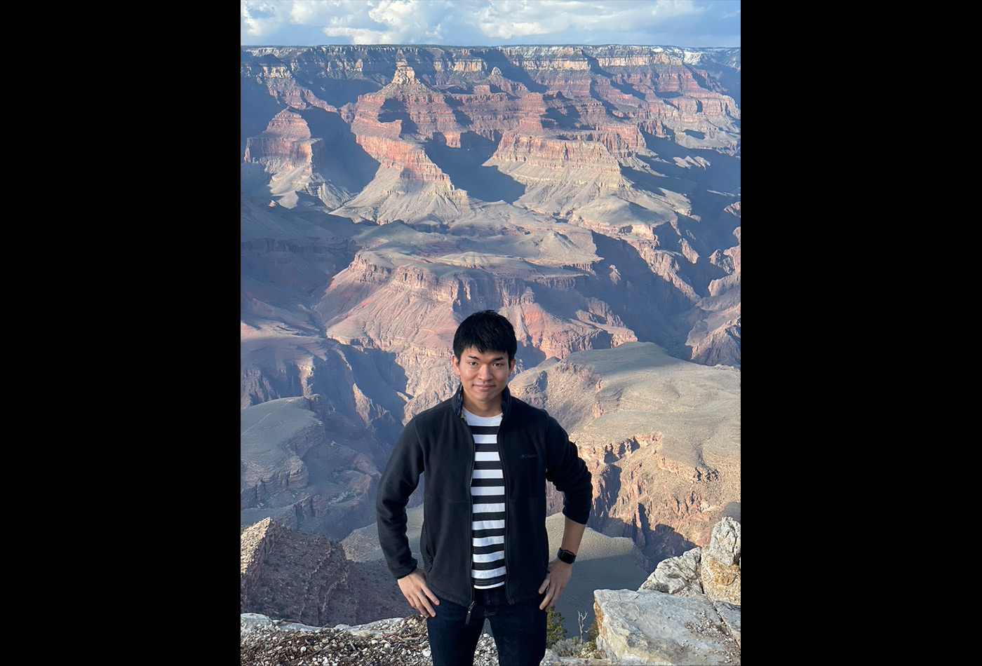 Ryotaro Okabe smiles in front of the Grand Canyon.