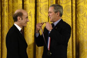 Professor Stephen J. Lippard receives a gold medal on a red, white, and blue ribbon from President George W. Bush.