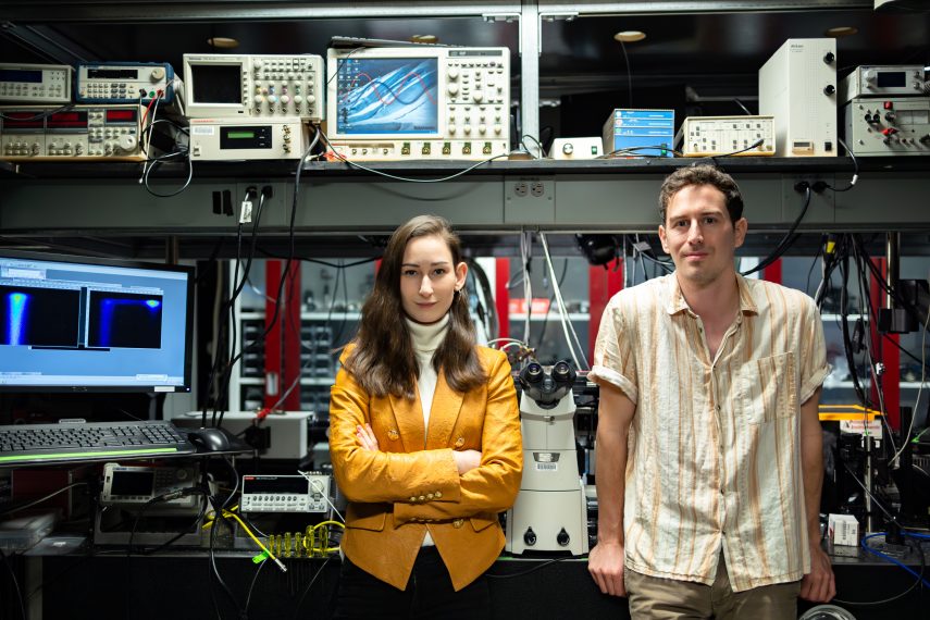 Madeleine Laitz, left, and lead author Dane deQuilettes stand side by side in the lab.