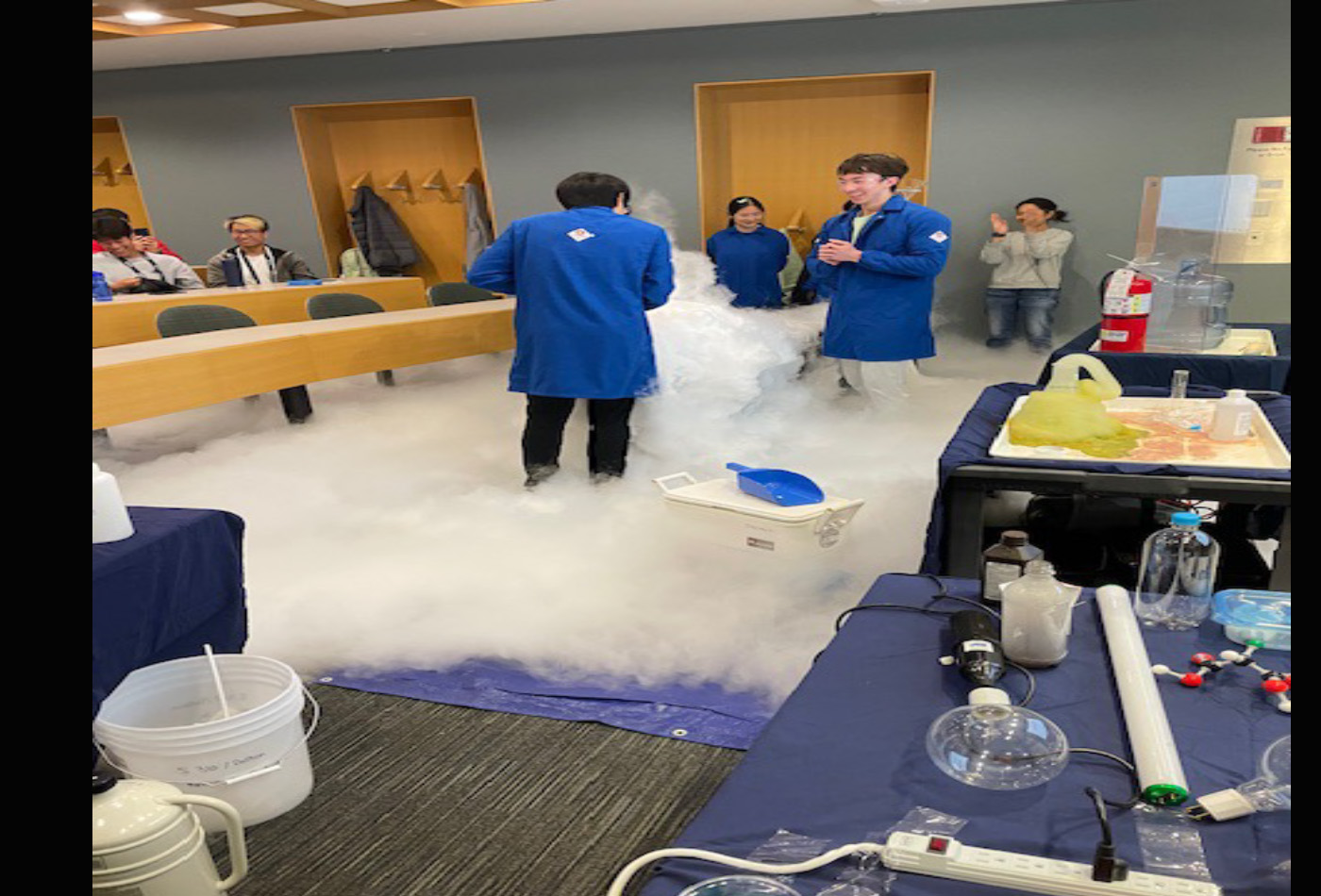 A group of students conduct magical experiments in a classroom.