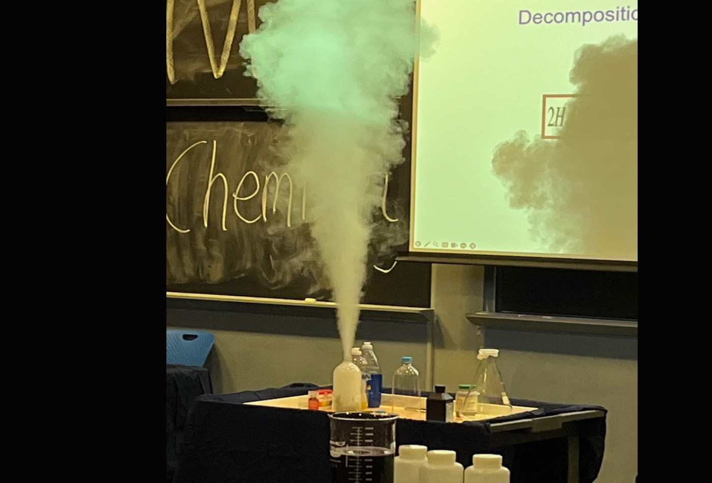 A beaker emits steam.
