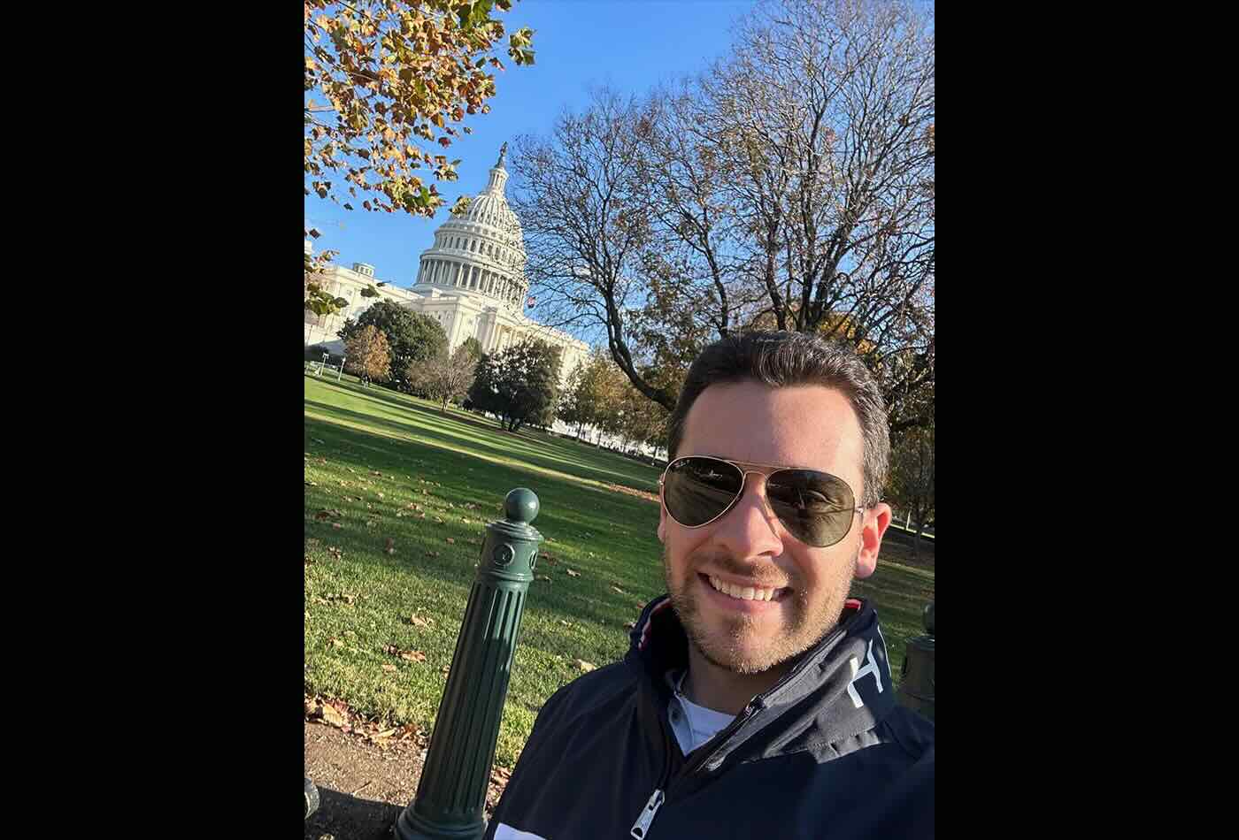 Paul Cesana smiles in front of the US Capitol Building in Washington, DC.