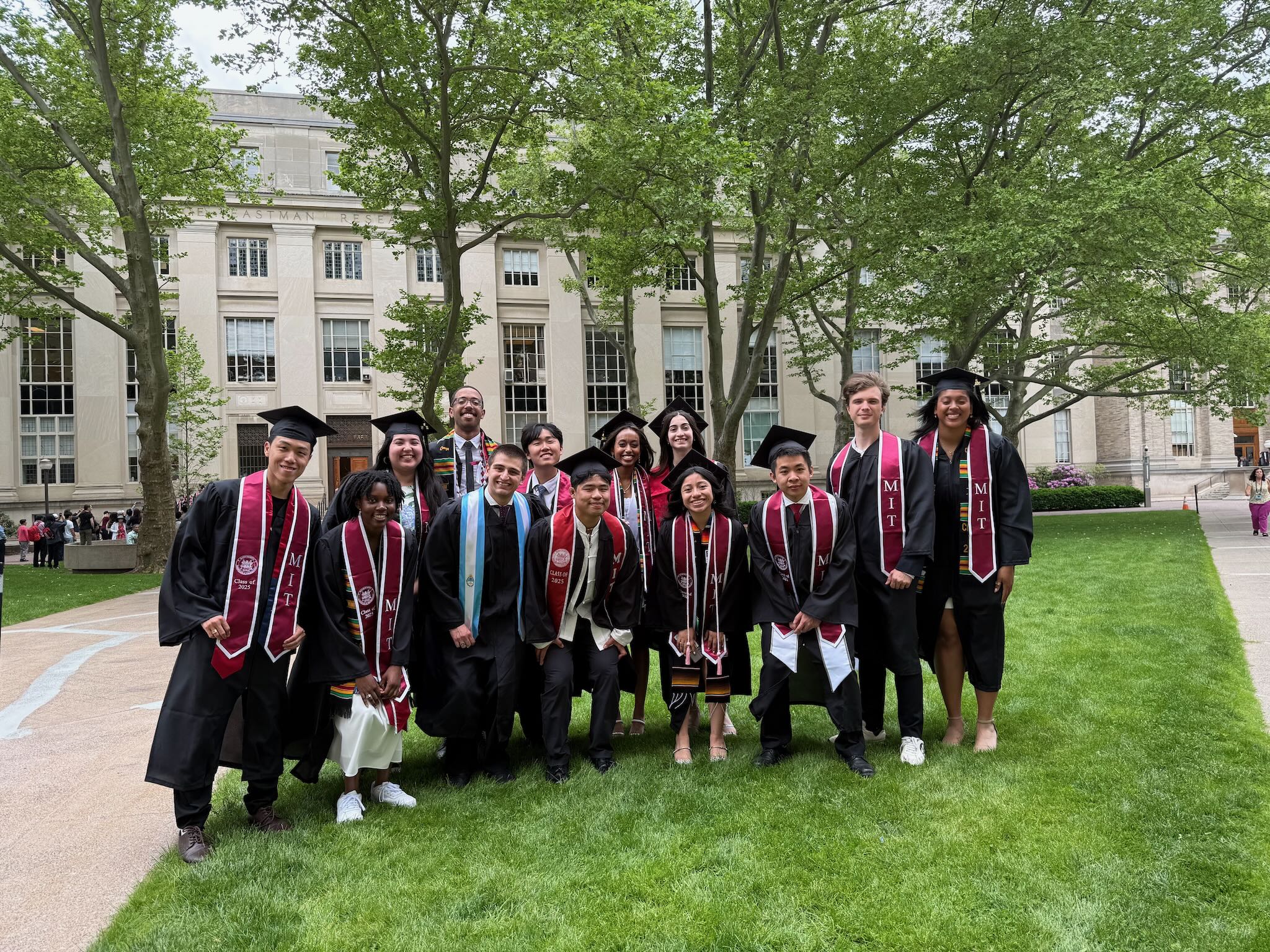 Class of 2025 graduates stand together on MIT campus.