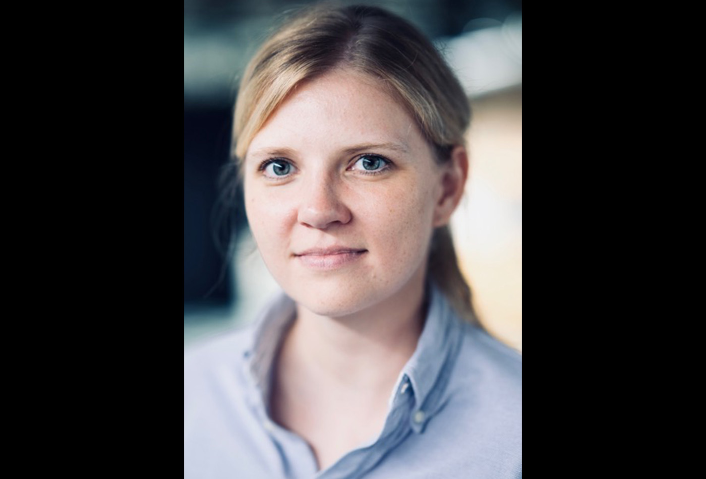 Gabi Wenzel smiles in a lab.