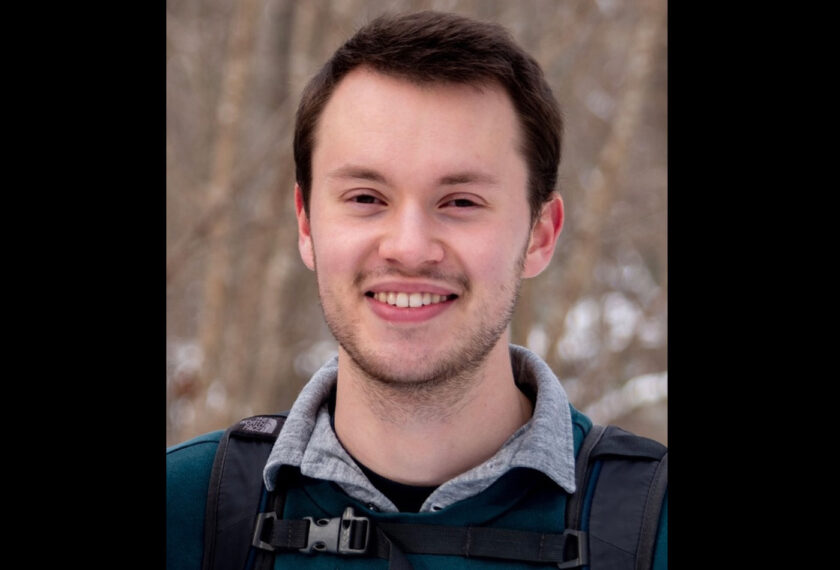 Jonah Horowitz smiles in an outdoor setting.